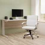 medium back office chair in white leather in front of an office desk