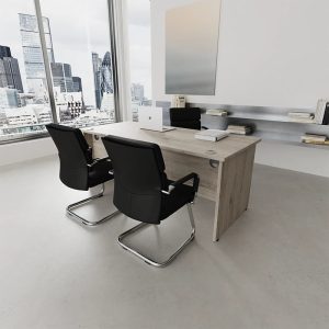visitor chair in black leather and chrome cantilever frame at office desk