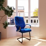blue fabric visitor chair with cantilever frame by window in office