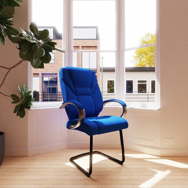 blue fabric visitor chair with cantilever frame by window in office