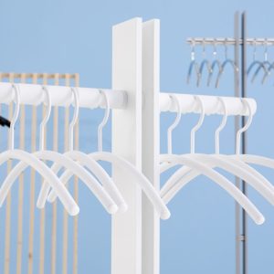 white coat hanger on coat stand
