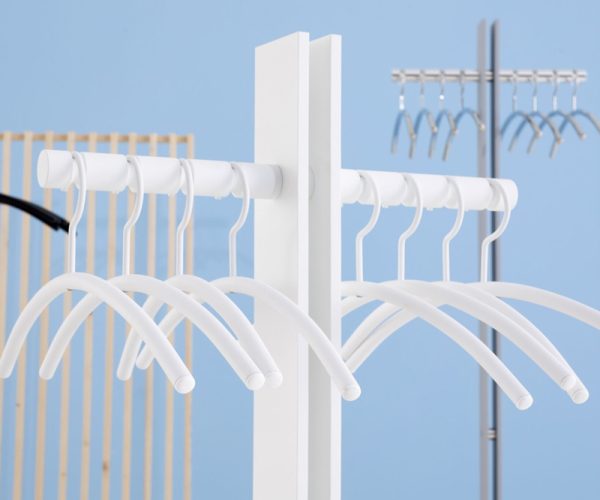 white coat hanger on coat stand