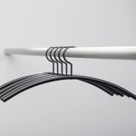 black coat hanger on rail