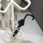 coat stand white with close up view of umbrella holder