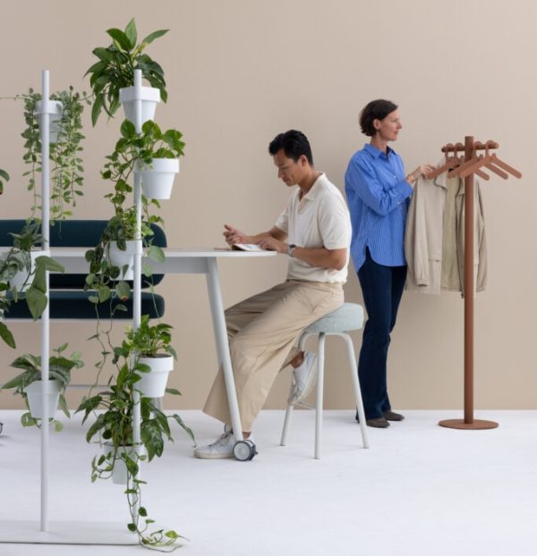contemporary coat stand in brown in office with people working