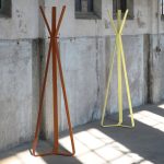 contemporary coat stand in brown and yellow outside