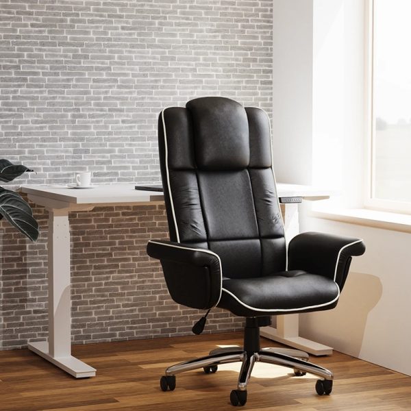 executive office chair in black leather in front of home office desk