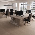 high back ergonomic operator chair in room shot with cantilever maple office desks