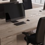 high back ergonomic operators chair in close up room shot with maple desks