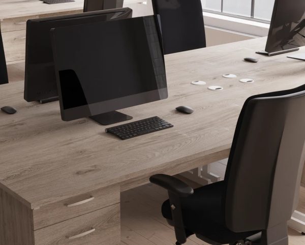 high back ergonomic operators chair in close up room shot with maple desks