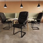 high back visitor chair in black leather in meeting room