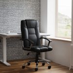 leather office chair in black leather in front of office desk