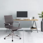 office chair medium back in green leather in front of office desk