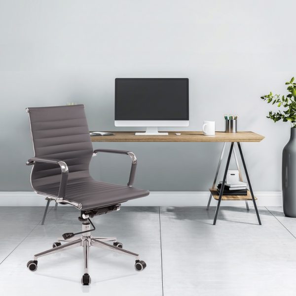 office chair medium back in green leather in front of office desk