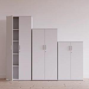3 white office cupboards different heights in a row.