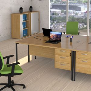 3 drawer office desks with H frame leg in oak finish in roomset