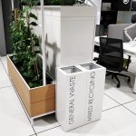 office recycling bin white with lettering in office roomshot