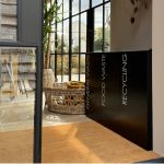 office recycling bins black in a row with white lettering