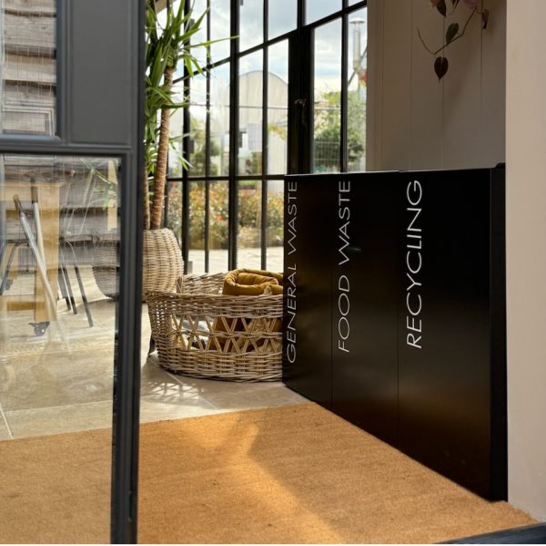 office recycling bins black in a row with white lettering