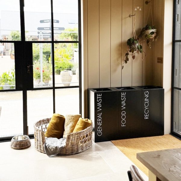 office recycling bins black with white lettering in cafe