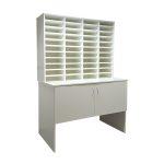 pigeon hole unit with 44 spaces on table with cupboard in white finish
