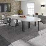 semi circular meeting table in meeting room with meeting chairs
