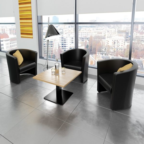 tub chairs in black leather in reception by window with city view