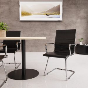 visitor chair with black leather seat and chrome cantilever frame around meeting table