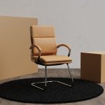 visitor chair in tan leather with chrome cantilever frame.
