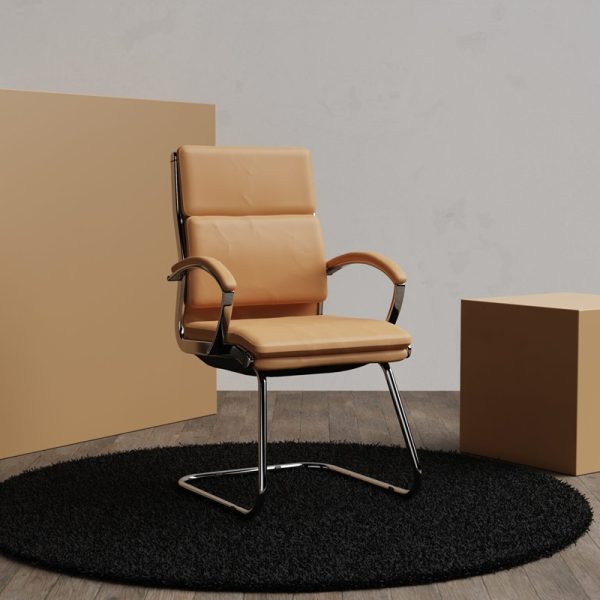 visitor chair in tan leather with chrome cantilever frame.