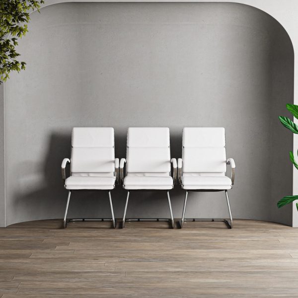 Italian style visitor chair in white leather and chrome cantilever frame. In a row of 3