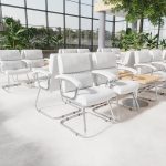 visitor chair in white leather with chrome cantilever frame