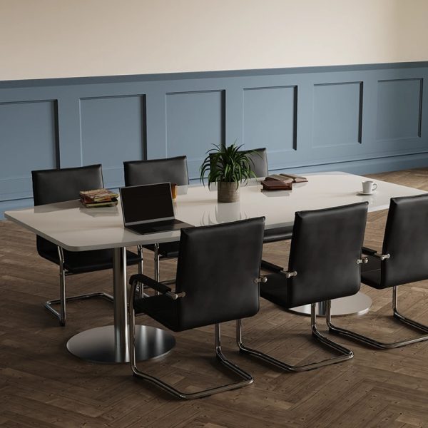 visitor chairs in black leather around a meeting table