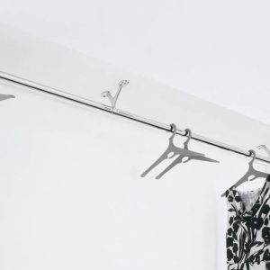 wall mounted coat rail on ceiling with dress hanging on it