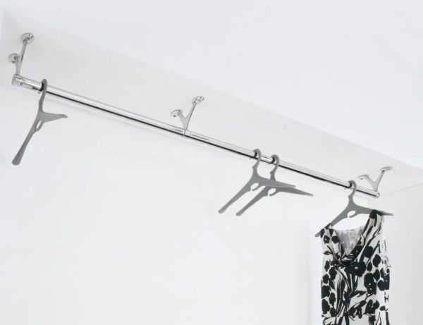wall mounted coat rail on ceiling with dress hanging on it
