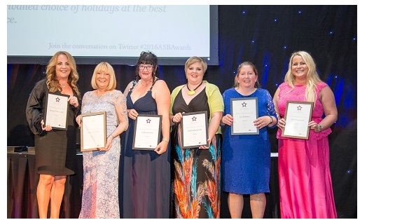 row of ladies in evening dresses with ward certificates