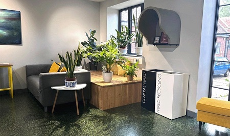 black and white office recycling bins in reception