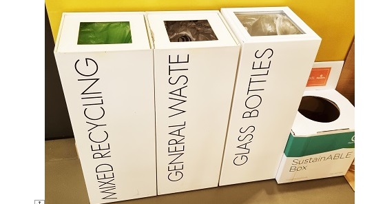 row of 3 white office recycling bins with mixed recycling, general waste and glass bottles in black lettering