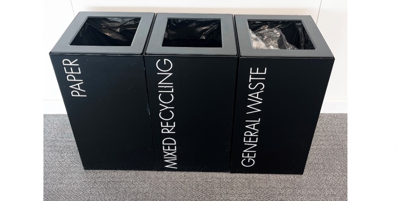 3 black office recycling bins with white lettering paper, mixed recycling and general wast