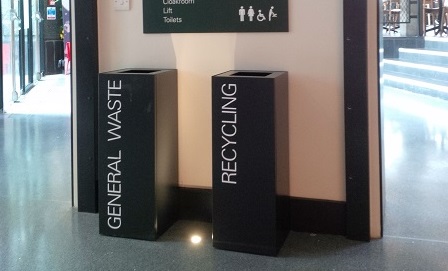 2 black square office recycling bins