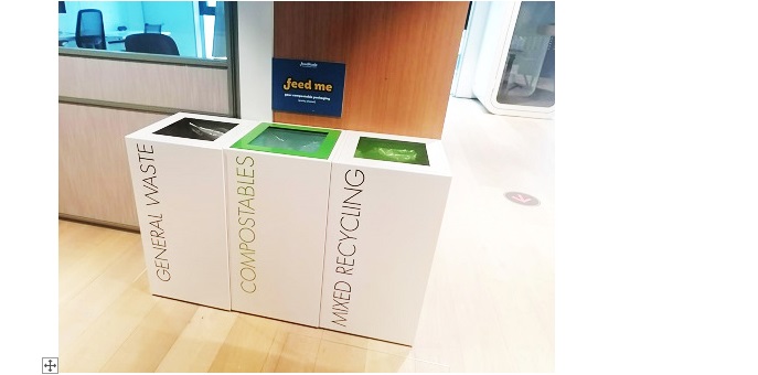 row of 3 white office recycling bins with lettering General Waste, Compostables and Mixed Recycling