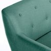 close up of green fabric reception sofa with buttoned back