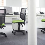 mesh back office chairs with lime green fabric seat by desk in office