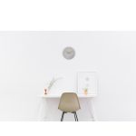 contemporary office clock in grey finish with wood hands and white numerals in office room set with office desk and office chair
