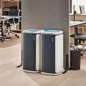 office recycling bin paper with blue top by a mixed waste bin in office set up