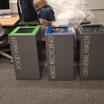 office recycling bins dark grey with lettering to indicate waste stream and coloured tops. Just been upacked