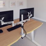 double monitor arm on office desk