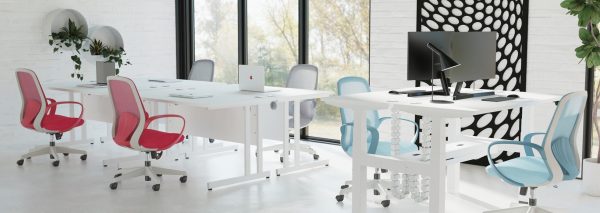mesh back operator chairs in blue, red and grey in open office with white office desks