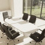 black executive office chair around a boardroom table