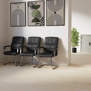 cantilever office visitor chair in black faux leather in row of 3 in waiting area